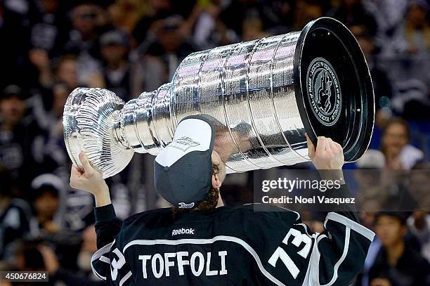 Tyler Toffoli of the Los Angeles Kings celebrates with the Stanley Cup after the Kings 3-2 double overtime victory against the New York Rangers in...