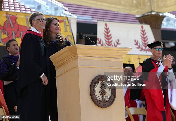 Microsoft founder and chairman Bill Gates shares the stage with his wife Melinda during the 123rd Stanford commencement ceremony June 15, 2014 in...