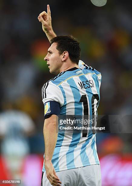 Lionel Messi of Argentina celebrates after scoring his team's second goal during the 2014 FIFA World Cup Brazil Group F match between Argentina and...