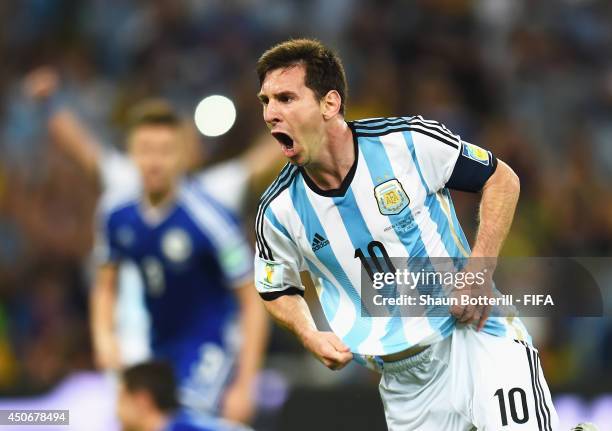 Lionel Messi of Argentina celebrates after scoring the team's second goal during the 2014 FIFA World Cup Brazil Group F match between Argentina and...