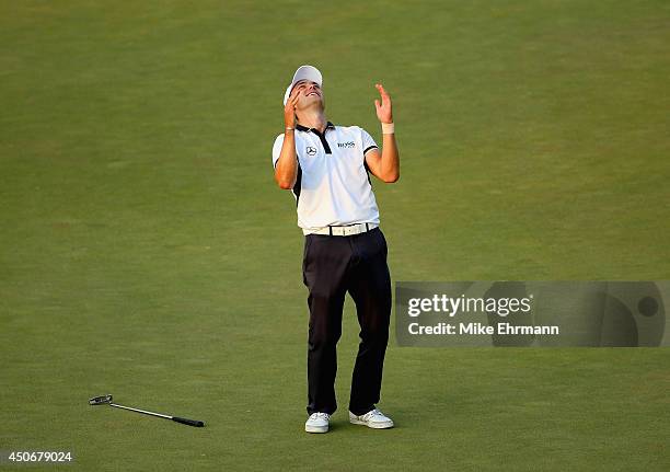 Martin Kaymer of Germany celebrates his eight-stroke victory on the 18th green during the final round of the 114th U.S. Open at Pinehurst Resort &...