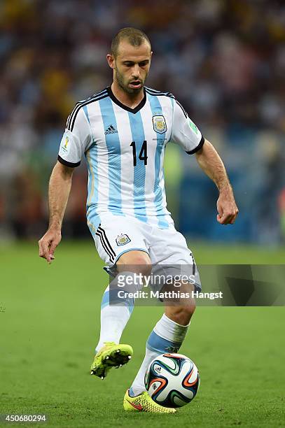 Javier Mascherano of Argentina on the ball during the 2014 FIFA World Cup Brazil Group F match between Argentina and Bosnia-Herzegovina at Maracana...