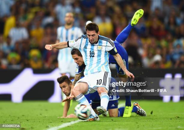 Lionel Messi of Argentina scores the team's second goal during the 2014 FIFA World Cup Brazil Group F match between Argentina and Bosnia-Herzegovina...