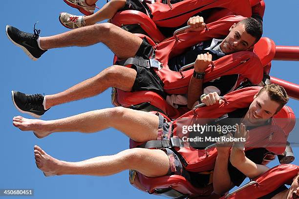 Christian Salem and Matt Scharenberg seen riding "The Claw" at Dreamworld ahead of the 2013 AFL Draft at Metricon Stadium on November 20, 2013 on the...