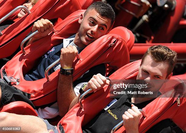 Christian Salem and Matt Scharenberg seen riding "The Claw" at Dreamworld ahead of the 2013 AFL Draft at Metricon Stadium on November 20, 2013 on the...