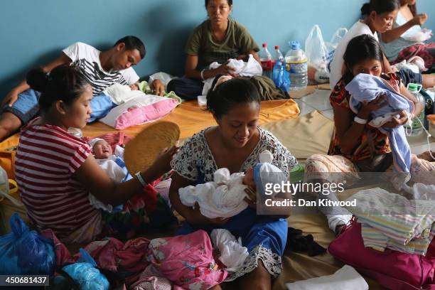 Newborn babies and their mothers share an overcrowded room in the children's and maternity ward at the Eastern Visayas Medical Centre on November 20,...