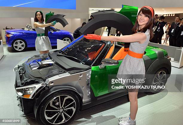 Japan's automaker Daihatsu Motor displays the company's mini sports car "Kopen" at the press preview of the Tokyo Motor Show in Tokyo on November 20,...