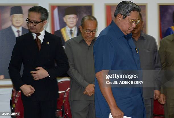 Indonesia's President Susilo Bambang Yudhoyono walks past Indonesia's Foreign Minister Marty Natalegawa and Indonesia's Ambassador to Australia...