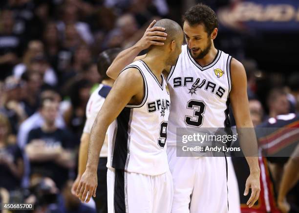 Tony Parker celebrates with Marco Belinelli of the San Antonio Spurs against the Miami Heat during Game Five of the 2014 NBA Finals at the AT&T...