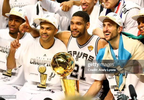 Tony Parker and Tim Duncan, and Manu Ginobili of the San Antonio Spurs celebrate after defeating the Miami Heat in Game Five of the 2014 NBA Finals...