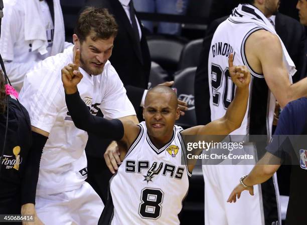 Patty Mills of the San Antonio Spurs celebrates after defeating the Miami Heat in Game Five of the 2014 NBA Finals at the AT&T Center on June 15,...