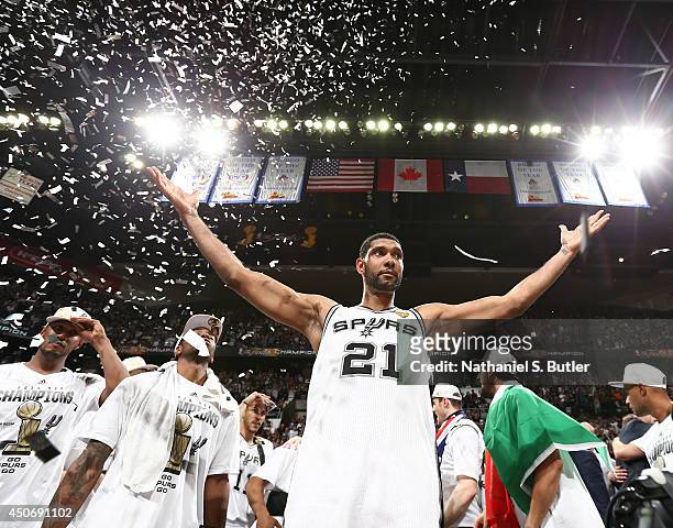 Tim Duncan of the San Antonio Spurs reacts with teammates after winning 2014 NBA Finals at AT&T Center on June 15, 2014 in San Antonio, Texas. NOTE...