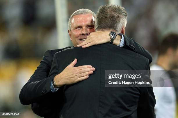 Coach Ricki Herbert of New Zealand hugs team manager Brian Turner after the final whistle during leg 2 of the FIFA World Cup Qualifier match between...