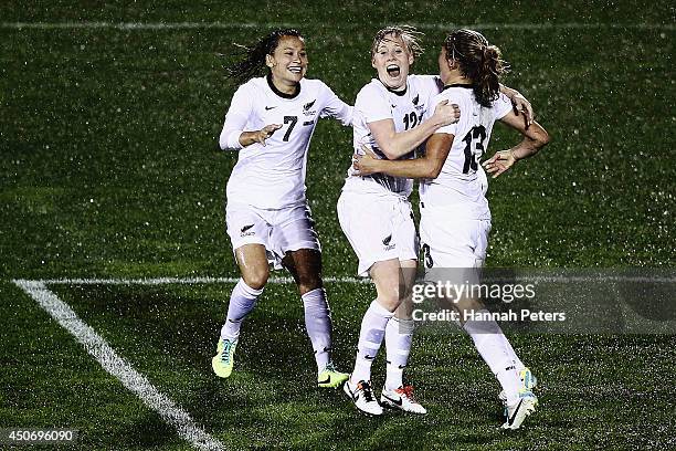 Rosie White of New Zealand celebrates with Ali Riley of New Zealand and Betsy Hassett of New Zealand after scoring a goal during the Women's...