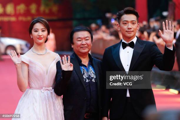 Actress Liu Yifei, director Gao Xixi and South Korea singer/actor Rain walk the red carpet at the 17th Shanghai International Film Festival on June...