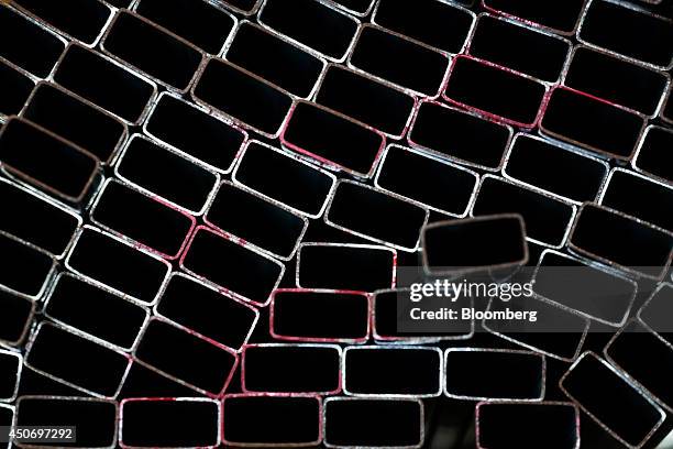 Steel rectangular tubing sits stacked on a shelf in the tube mill at the manufacturing facility of Uttam Galva Steels Ltd., the Indian unit of...