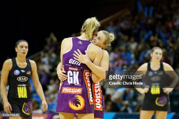 Laura Geitz and Gabi Simpson of the Firebirds celebrate winning the ANZ Championship Preliminary Final match between the Firebirds and the Magic at...