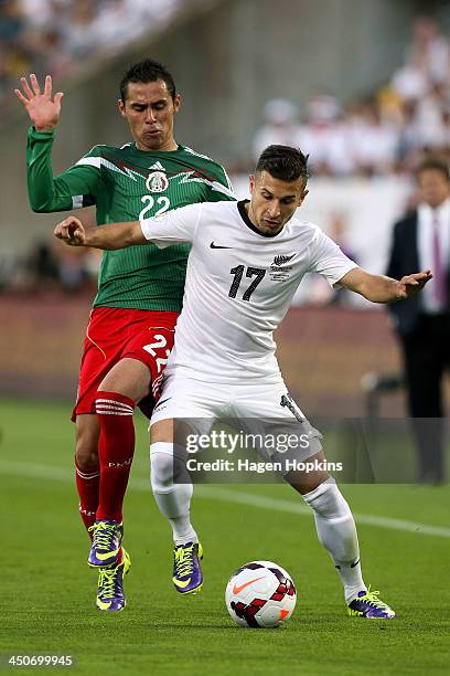 Kosta Barbarouses of New Zealand holds off the challenge of Paul Aguilar of Mexico during leg 2 of the FIFA World Cup Qualifier match between the New...