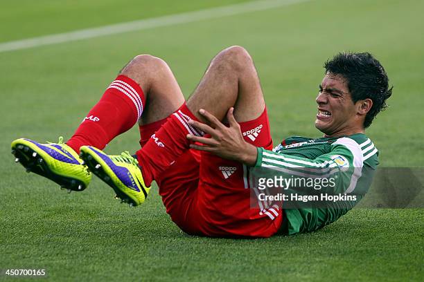Raul Jimenez of Mexico reacts after a heavy challenge during leg 2 of the FIFA World Cup Qualifier match between the New Zealand All Whites and...