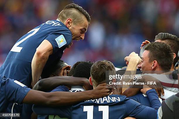 Mathieu Debuchy of France celebrates after a shot from Karim Benzema of France went in off Noel Valladares of Honduras to score an own goal during...