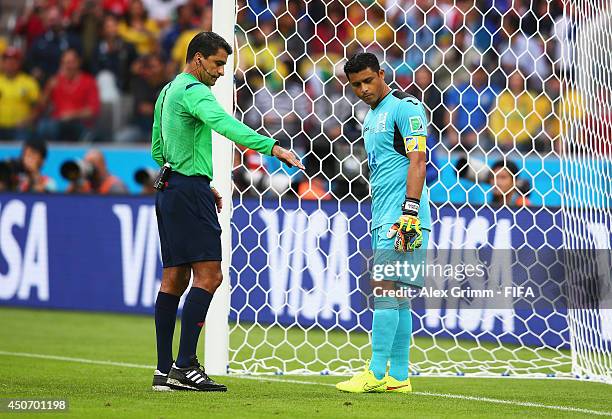 Referee Sandro Ricci talks to goalkeeper Noel Valladares of Honduras during the 2014 FIFA World Cup Brazil Group E match between France and Honduras...