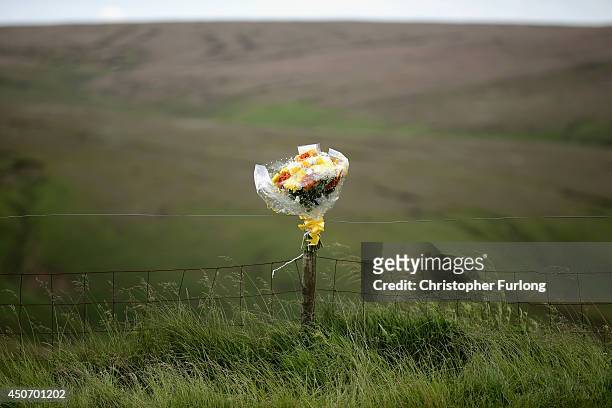 Floral tributes overlook Saddleworth Moor where the body of missing Keith Bennett may be buried on June 16, 2014 in Saddleworth, United Kingdom....