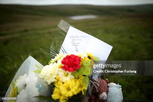 Floral tribute to Keith Bennett, from the family of moors murder victim John Kilbride, overlooks Saddleworth Moor where the body of missing Keith...