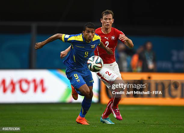 Joao Rojas of Ecuador is closed down by Stephan Lichtsteiner of Switzerland during the 2014 FIFA World Cup Brazil Group E match between Switzerland...