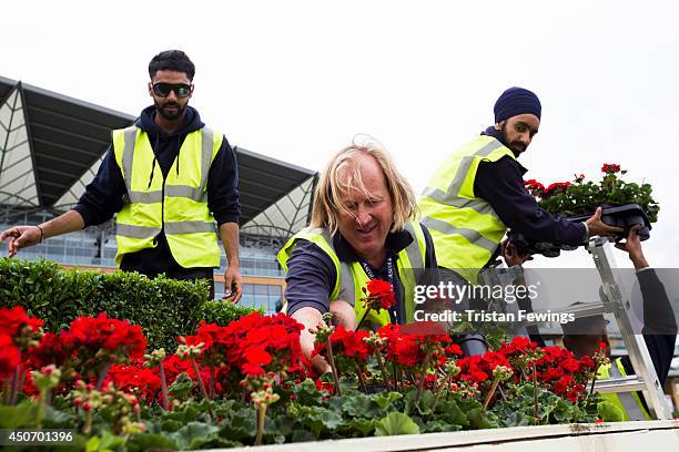 Flowers are put in place as the finishing touches are added ahead of Royal Ascot 2014 at Ascot Racecourse on June 16, 2014 in Ascot, England.