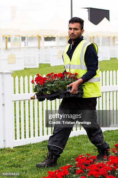 Flowers are put in place as the finishing touches are added ahead of Royal Ascot 2014 at Ascot Racecourse on June 16, 2014 in Ascot, England.