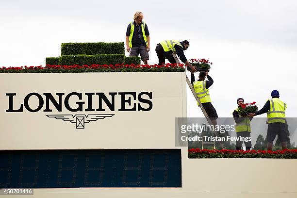 Flowers are put in place as the finishing touches are added ahead of Royal Ascot 2014 at Ascot Racecourse on June 16, 2014 in Ascot, England.