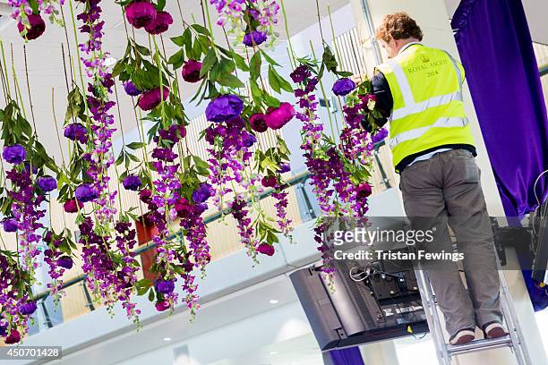 Flowers are put in place as the finishing touches are added ahead of Royal Ascot 2014 at Ascot Racecourse on June 16, 2014 in Ascot, England.