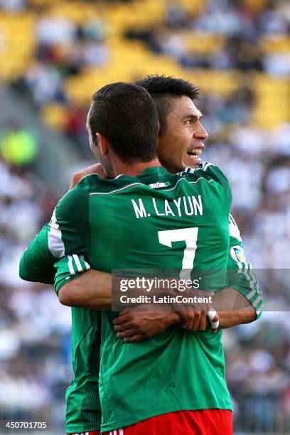 Oribe Peralta of Mexico celebrates his goal with teammate Miguel Layun during leg 2 of the FIFA World Cup Qualifier match between the New Zealand All...