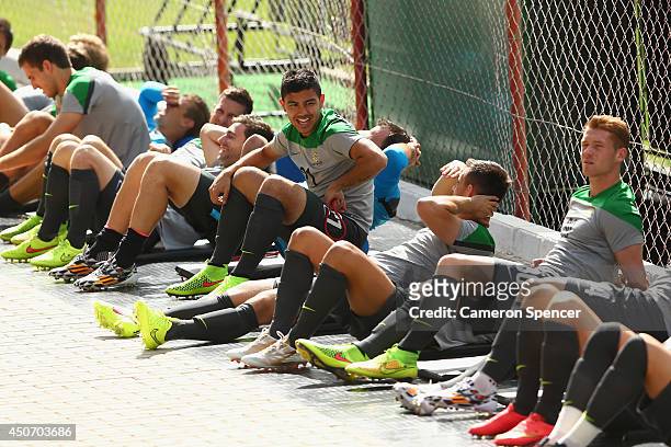 Massimo Luongo of the Socceroos and team mates stretch during an Australian Socceroos training session and press conference at Arena Unimed Sicoob on...