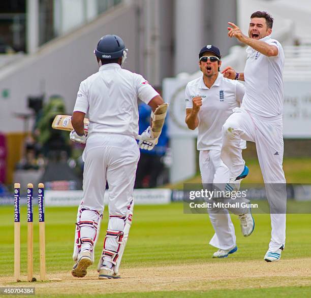 James Anderson of England celebrates taking the wicket of Kumar Sangakkara of Sri Lanka during the Investec 1st Test Match day five between England...