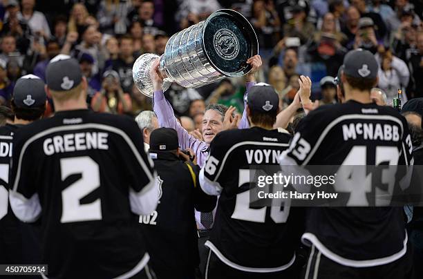 President, General Manager, and Alternate Governor Dean Lombardi of the Los Angeles Kings celebrates with the Stanley Cup after the Kings 3-2 double...