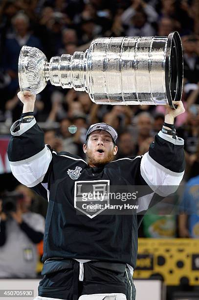 Jonathan Quick of the Los Angeles Kings celebrates with the Stanley Cup after the Kings 3-2 double overtime victory against the New York Rangers in...