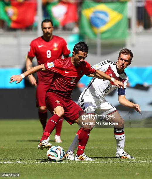 Joao Moutinho of Portugal controls the ball against Philipp Lahm of Germany during the 2014 FIFA World Cup Brazil Group G match between Germany and...