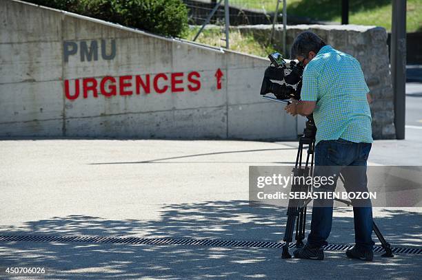 Cameraman films the CHUV hospital in Lausanne on June 16 where Formula One champion and former pilot Michael Schumacher was transferred from a French...