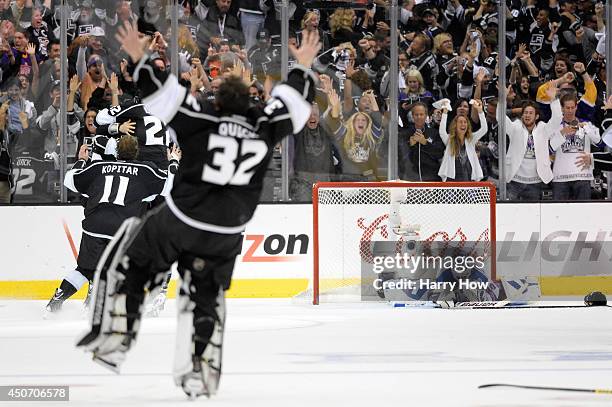 Henrik Lundqvist of the New York Rangers sits on the ice after Alec Martinez of the Los Angeles Kings scores the game-winning goal in double overtime...