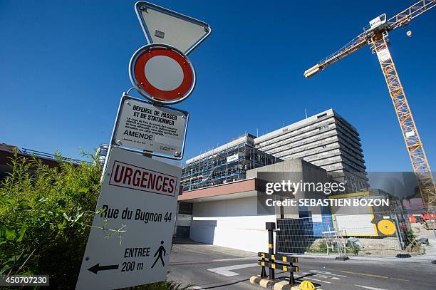 Sign indicates the emergency entry of the CHUV hospital in Lausanne on June 16 where Formula One champion and former pilot Michael Schumacher was...