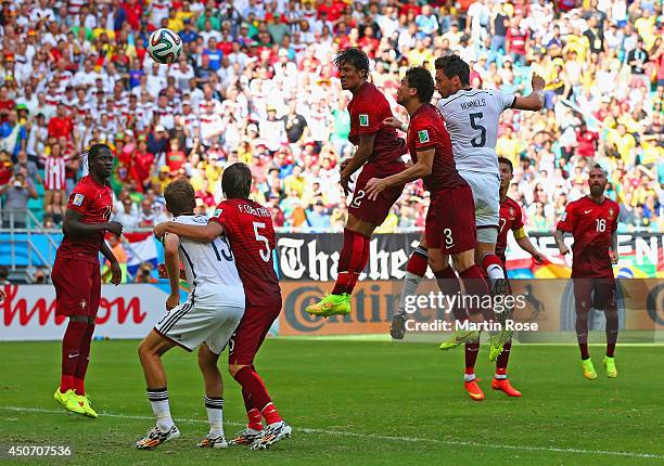 Mats Hummels of Germany scores on a header for his team's second goal against Bruno Alves and Pepe of Portugal during the 2014 FIFA World Cup Brazil...