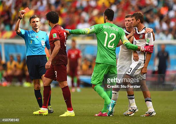 Pepe of Portugal is shown a red card and sent off by referee Milorad Mazic during the 2014 FIFA World Cup Brazil Group G match between Germany and...