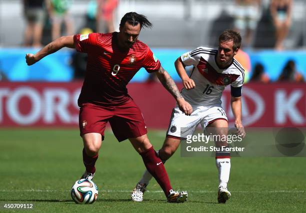Hugo Almeida of Portugal dribbles past Philipp Lahm of Germany during the 2014 FIFA World Cup Brazil Group G match between Germany and Portugal at...