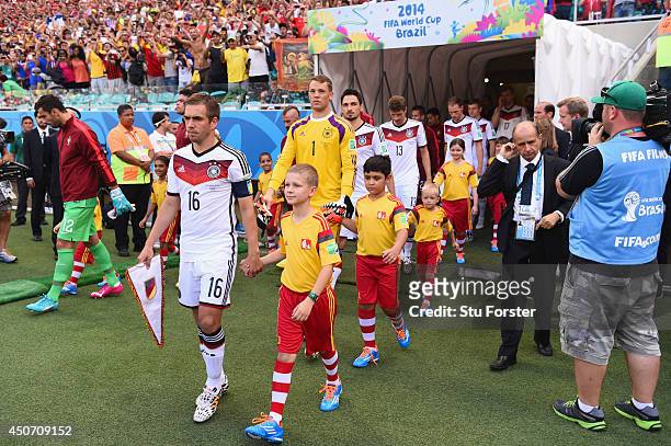 Philipp Lahm of Germany enters the pitch before the 2014 FIFA World Cup Brazil Group G match between Germany and Portugal at Arena Fonte Nova on June...