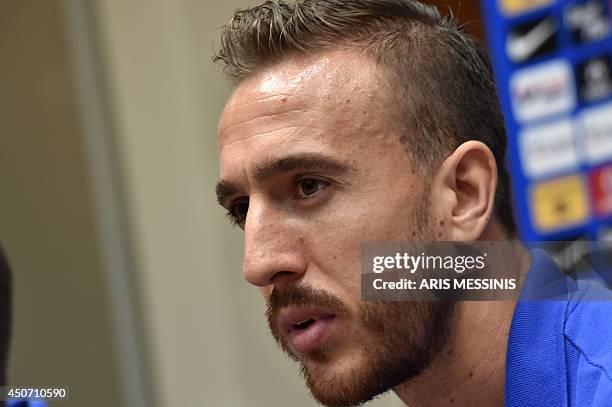 Greece's goalkeeper Panagiotis Glykos speaks during a press conference in Aracaju on June 16 three days before the Group C football match between...