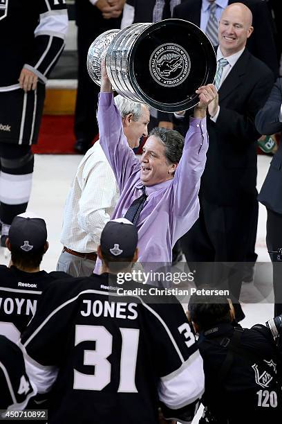 President, General Manager, and Alternate Governor Dean Lombardi of the Los Angeles Kings celebrates with the Stanley Cup after the Kings 3-2 double...