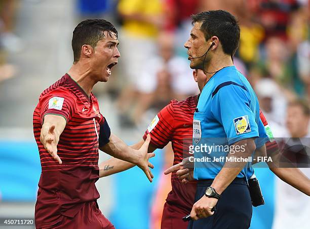 Cristiano Ronaldo of Portugal protests with referee Milorad Mazic during the 2014 FIFA World Cup Brazil Group G match between Germany and Portugal at...