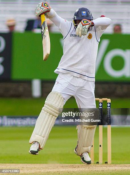 Rangana Herath of Sri Lanka gloves the ball and is caught out during the Investec 1st Test Match day five between England and Sri Lanka at Lords...