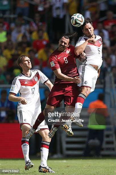 Mats Hummels of Germany heads the ball over Hugo Almeida of Portugal during the 2014 FIFA World Cup Brazil Group G match between Germany and Portugal...